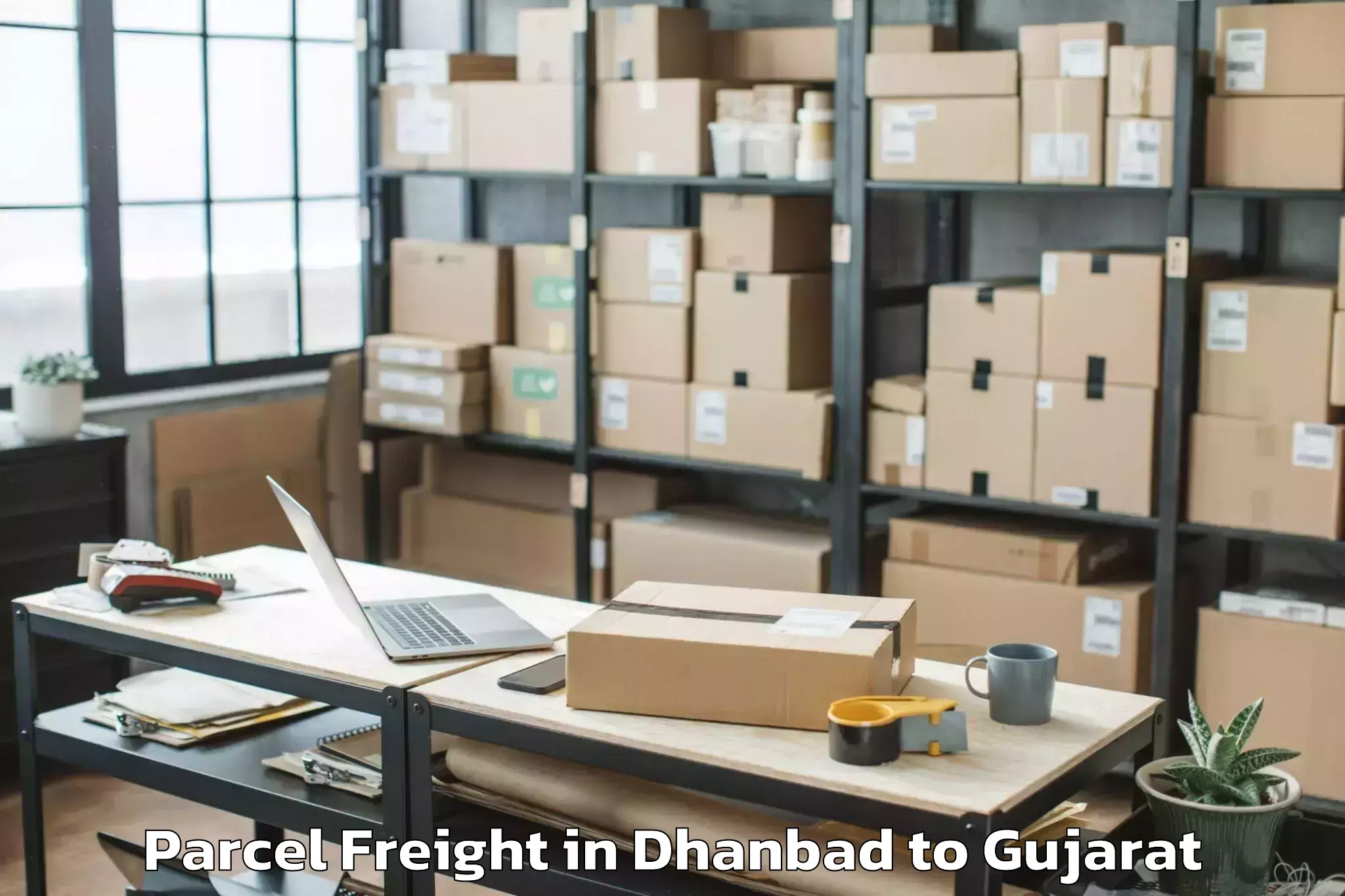 Easy Dhanbad to Koyali Parcel Freight Booking